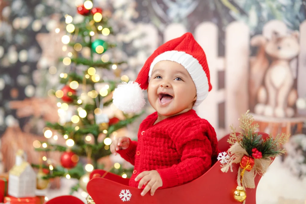 Baby in a Christmas theme photoshoot showcasing a safe setup in Ahmedabad.