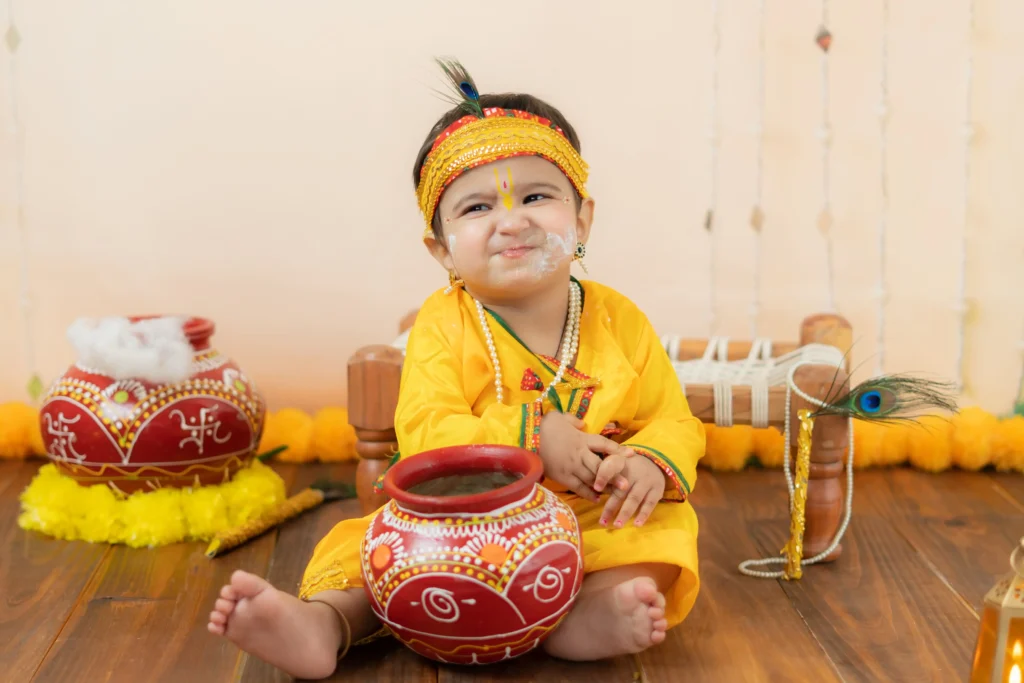 Baby dressed in traditional attire for a themed photoshoot in Ahmedabad.